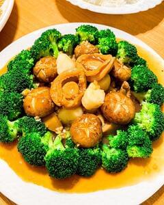 Braised abalone with scallops, mushrooms and broccoli